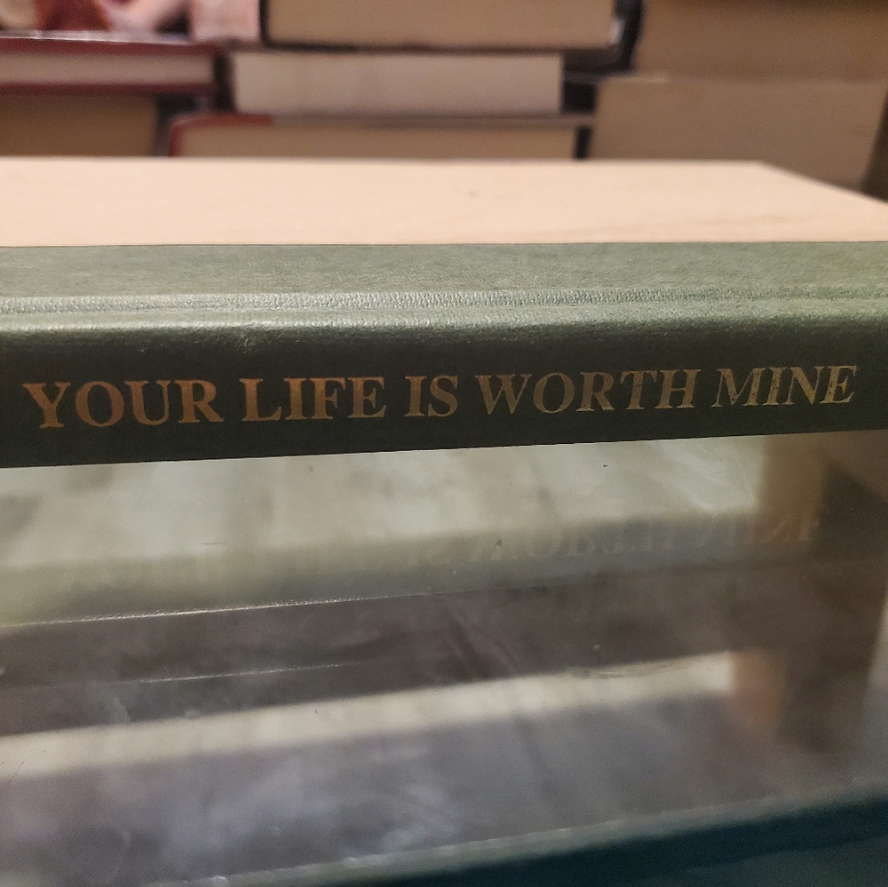 Your Life Is Worth Mine, Book